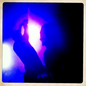 blue lights illuminate a person dancing