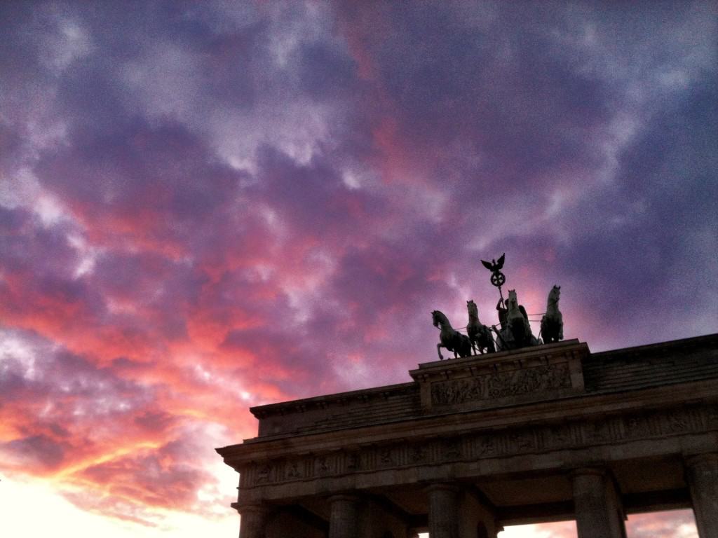 Pink and Purple Sunset with Brandenburg Gate in Berlin with shadowed columns and large horse statue