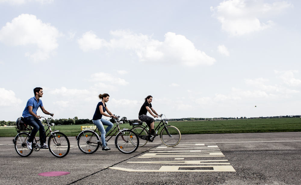 three people biking 