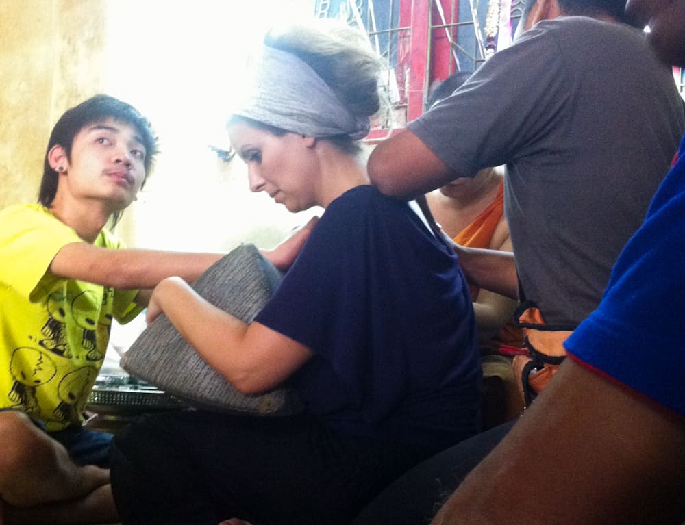 me getting a sak yant wat bang phra thailand four people sitting