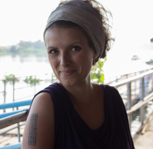 Woman with hairband and a tattoo on her arm