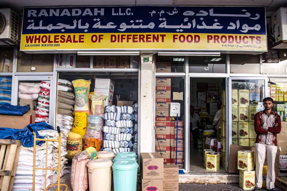 whole sale food market with food stacked in tall columns 