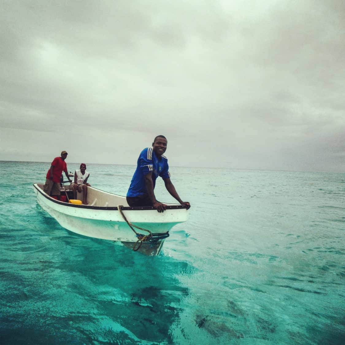 three men in a boat