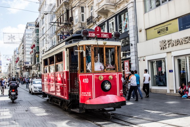 red tram on a street