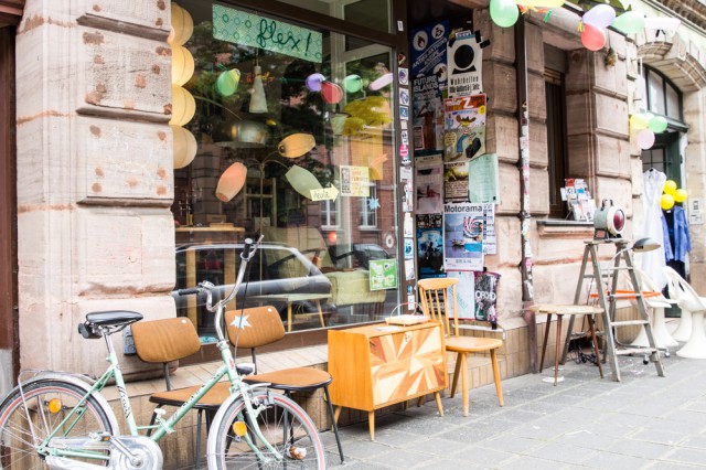 shop entrance with bike and chairs