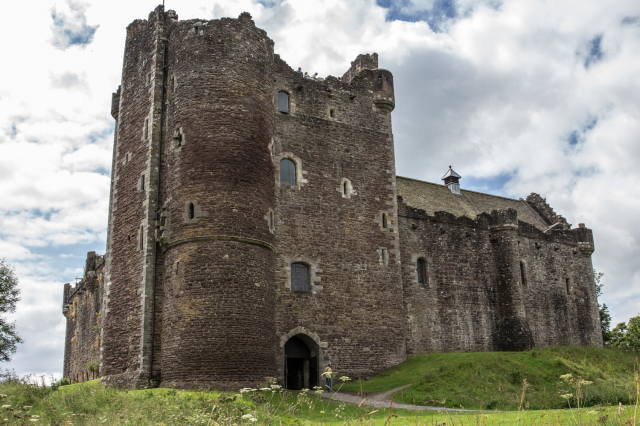 Doune Castle with a large tower and some castle ruins