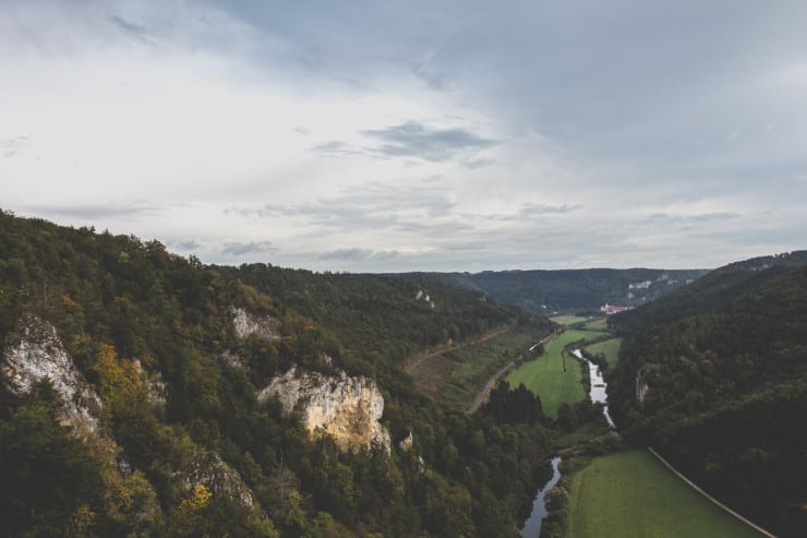 green valley with small hills on either side of the valley