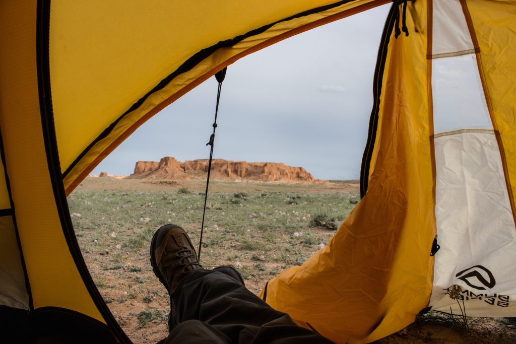 View of a rock from inside a yellow tent