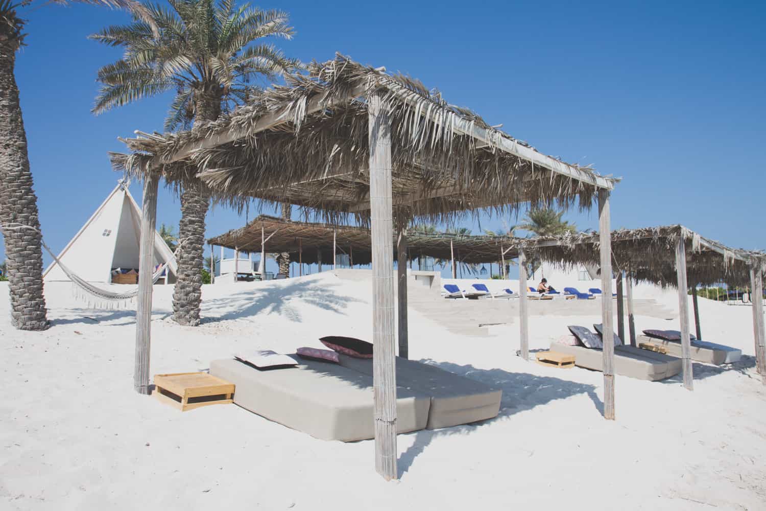 zaya nurai island sunbed at a beach with several sunbeds