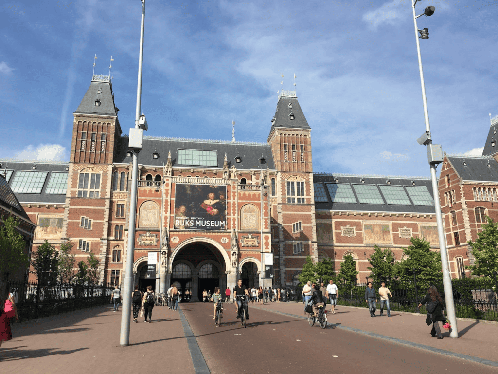 Amsterdam Bikes through the Rijks Museum with blue sky