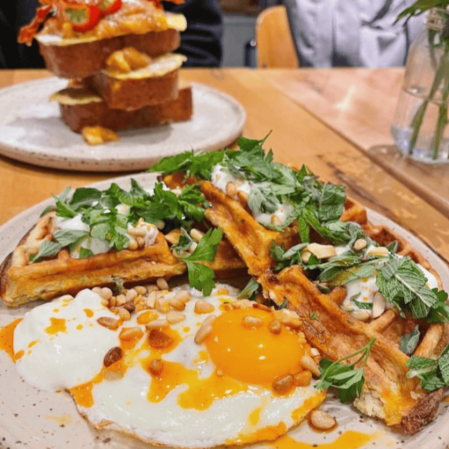 1 sunny side up Egg and Waffles with herbs 