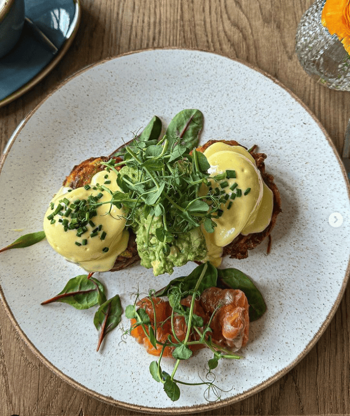 Two Eggs Benedict with a side salad