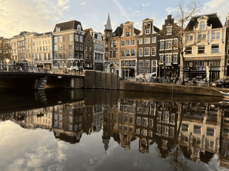 Amsterdam Canal Houses perfectly reflected in the canal water 