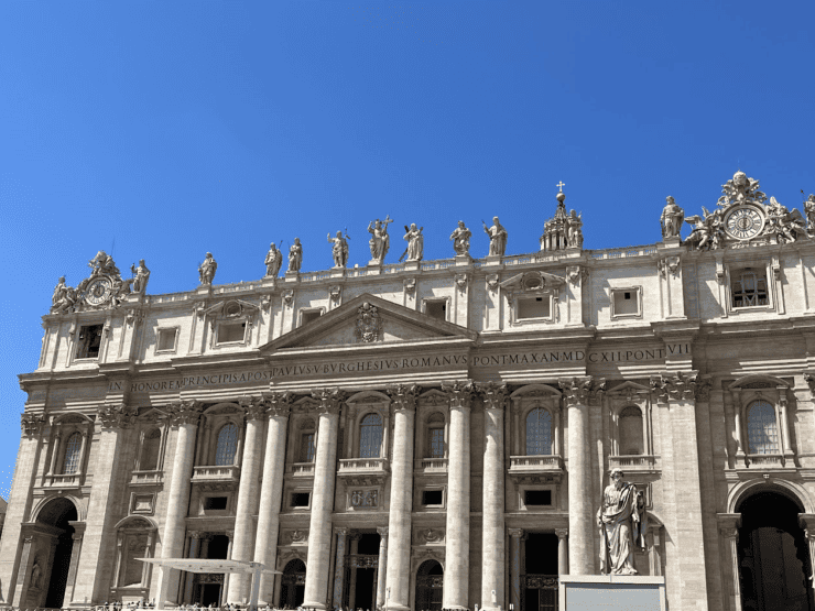 Vatican Building with Baroque design with 8 columns and many statues 