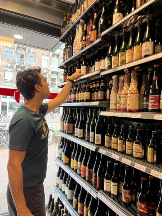 Man looking at large selection of specialty beers at Sterk Beer Amsterdam