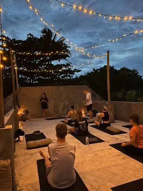 People doing yoga on a terrace