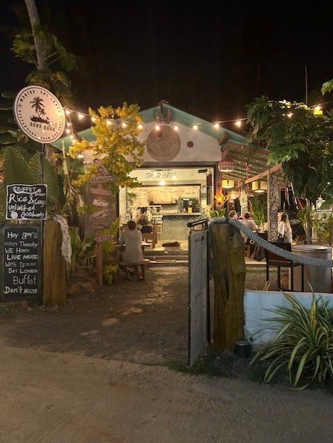 front of a restaurant at night