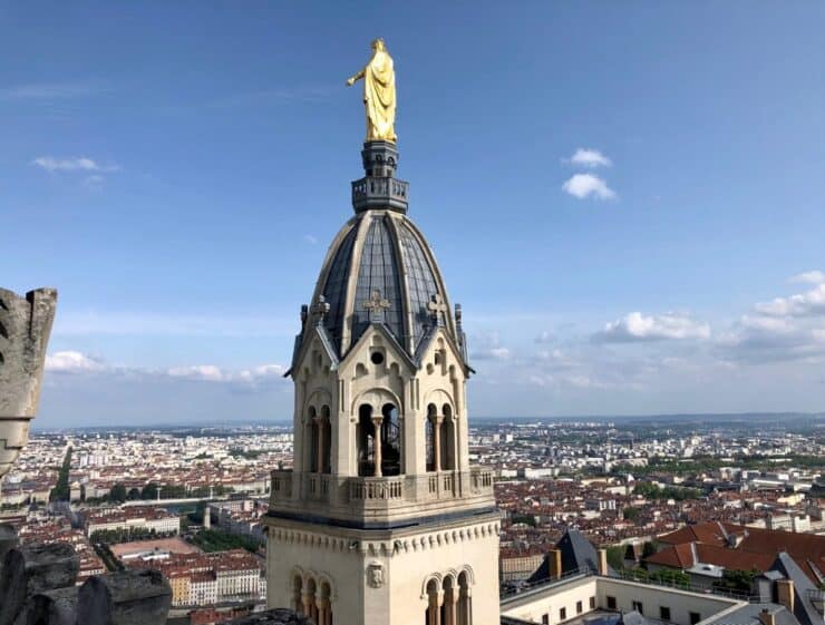Lyon City Views with a large bell town over looking the rooftops with blue skies